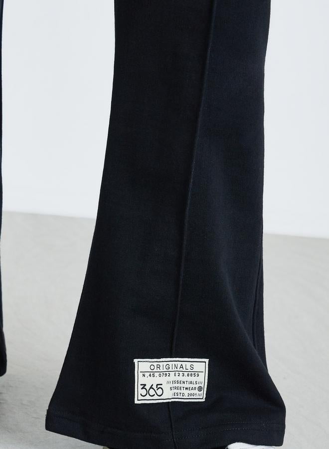 Styli Women Black  Black Wide Leg Joggers with Badge Detail - Image 3